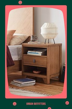 an image of a nightstand with books on it