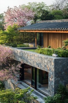 a house that is surrounded by trees and bushes