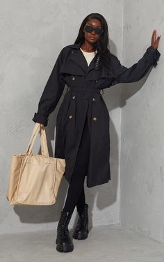 Upgrade your off-duty look with this seriously chic trench coat. Featuring a black material with an oversized fit and belted detail, we're obsessed. Add chunky boots, shades, and your go-to bag for a look we're obsessing over.   Length approx 123cm/51 (Based on a sample size UK 8)   Model wears size UK 8/ EU 36/ AUS 8/ US 4   Model Height - 5ft 10 Black Trench Coat Outfits, Black Trench Coat Outfit Casual, Tall Women Outfits, Staple Outfits, Black Trenchcoat, Long Black Trench Coat