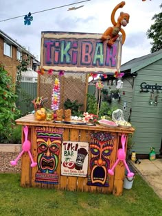 an outdoor tiki bar decorated with decorations