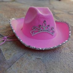 Pink Cowgirl Hat With Tiara - It Lights Up! - Cowgirl Clutch Pink Cowgirl Hat, Pink Tiara, Cowboy Hat Styles, Festival Fancy Dress, Pink Cowboy Hat, Hats Style, Pink Cowboy, Outdoor Girls, Purple Feather