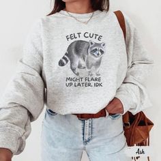 Stay comfy and cheeky in this "Felt Cute, Might Flare Up Later IDK" sweatshirt--perfect for anyone with a hidden disability or chronic illness who rocks life with humor! Whether you're managing POTS, fibromyalgia, or chronic pain, this sweater is a fun and empowering gift for those who understand the ups and downs of living with a flare-up. Prefer this design on a T-Shirt? Visit this link:  Everything You Need to Know: 🧥 Sweatshirt Brand Gildan | Unisex Adult Sizing | 50% Cotton, 50% Polyester ⏳🚚 Production & Shipping All items are made-to-order. They will ship within 1-5 business days from one of our printing partners, shipping usually takes between 2-5 business days after the item is shipped. Please allow sufficient time for production and shipping.  Important: Please double-check your Funny Crew Neck Sweatshirt With Print, Funny Winter Top With Text, Winter Funny Style Top With Text, Winter Funny Text Top, Cute Long Sleeve Tops With Funny Text, Funny Long Sleeve Sweatshirt With Print, Funny Long Sleeve Tops With Cartoon Print, Funny Print Long Sleeve Sweatshirt, Novelty Long Sleeve Cotton Tops