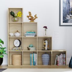 a living room filled with lots of furniture and bookshelves next to a plant