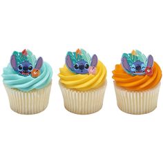 three cupcakes with frosting on top of each one in different colors and designs