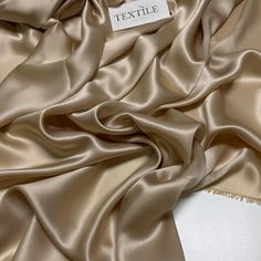 Pearl beige satin silk, fabric by the meter, made from high-quality natural silk. Perfect for creating elegant dresses, soft blouses, and unique designer pieces. This Italian deadstock fabric offers an eco-friendly choice for sewing projects, combining timeless style with the beauty of color pearl beige. Please note! The color of the fabric may differ slightly from the original color due to the screen settings of your devices. ⚠️ PAY ATTENTION TO OUR POLICY 👉 We do not accept exchanges and returns, as the fabric is cut to fit each order. 👉 The price is for one meter. To order several meters, please order the appropriate number of units in the cart. 👉 All fabrics are sent in running lengths. For example, if you order 3 meters, we will send a continuous length of fabric measuring 3 meters Silk Satin Fabric, Special Clothes, For Wedding Dress, Designer Pieces, Luxury Silk, Dress Designer, Matching Accessories, Natural Silk, Italian Fabric