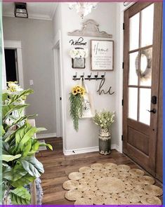 the entryway is decorated with sunflowers and potted plants