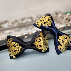 100% Hand-made High-quality bow tie FREE US Domestic shipping Made with high-quality fabric with gold decorative applique Rare and Unique Bow.  Pre-tied with an adjustable neck strap Measurement approx. 10cm L x 6 cm H Perfect for wedding or any special occasion *Presented in a gift box. Best gift for your love one or yourself! Gold Bow With Tie Back For Wedding, Formal Gold Suit And Tie Accessories With Decorative Bow, Gold Elegant Bow With Tie Back, Elegant Gold Bow With Ties, Gold Bow Ties For Black Tie Events, Gold Bow Tie For Formal Occasions, Gold Bow With Ties For Gifts, Satin Ties With Decorative Bow For Party, Party Satin Ties With Decorative Bow