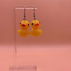 adorable rubber duck earrings on stainless steel nickel-free earring wire * Material: silver-plated, nickel free metal, resin OTHER INFO * Can't find the information you need or need some advice? Feel free to contact us. We are fast to reply :) WHEN WILL MY ORDER ARRIVE? * This design is ready to ship in 1 - 2 business days. Please check our home page for the most current times. OUR POLICIES https://www.etsy.com/shop/stayfoxydesigns?ref=dashboard-header#policies MORE FROM STAY FOXY https://www.etsy.com/shop/stayfoxydesigns Thank you so much for visiting and hope you enjoy shopping with us ♡ Alaina ♡ Duck Earrings, Earrings Funky, Dashboard Header, Earring Wire, Earrings Colorful, Nickel Free Earrings, Fun Earrings, Rubber Duck, Jewelry Earrings Dangle