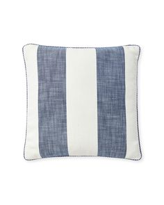 a blue and white striped pillow on a white background