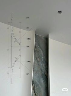 an architectural drawing is shown in the corner of a room with white walls and flooring