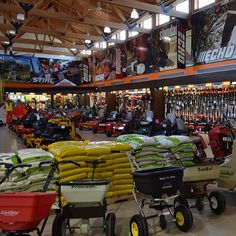 there are many different types of lawn mowers in this store with the words turf tuesday on it