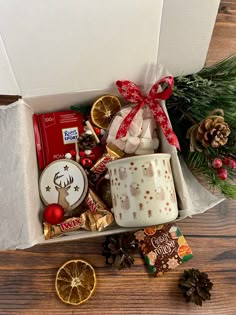 a christmas gift box filled with treats and candies