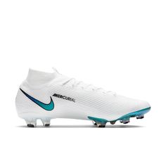 the nike meron fg soccer shoe is shown in white and teal blue