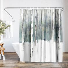 a shower curtain with an abstract painting of trees in the woods on it's side