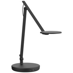 a black desk lamp on a white background