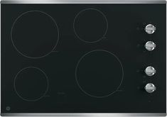 an electric stove with three burners and four knobs