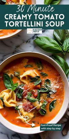 two bowls of creamy tomato tortelli soup with basil leaves on top and the title overlay reads 30 minute creamy tomato tortelli soup