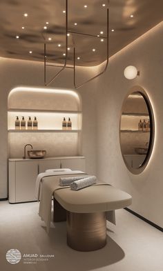 a spa room with an oval mirror above it