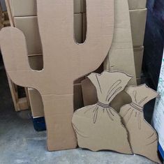 cardboard cutouts are stacked on top of each other in the shape of a cactus