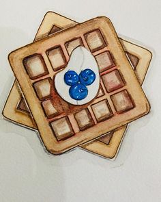 two waffles with blue and white buttons on them