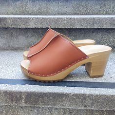 MADE FROM VEGAN LEATHER AND ALDER WOOD Clogs for Women Toren HIGH heals ergonomic wooden sole and Vegan leather. made to order. Available in sizes 36-41. For other sizes please contact me EUR 35 l UK 2.5 l AUS 4.5 l USA 5 l up to 22.3cm l 8.78 inches  EUR 36 l UK 3.5 l AUS 5.5 l USA 6 l up to 23cm l 9.02 inches EUR 37 l UK 4 l AUS 6 l USA 6.5 l up to 23.7cm l 9.33 inches  EUR 38 l UK 5 l AUS 7 l USA 7.5 l up to 24.5cm l 9.65 inches EUR 39 l UK 6 l AUS 8 l USA 8.5 l up to 25.3cm l 9.96 inches EUR Classic Brown High Heel Mules, Casual Wood Mules With Round Toe, Classic Brown Open Toe Mules, Orange Mules With Removable Insole And Round Toe, Closed Toe Mules With Wooden Heel, Orange Round Toe Clogs With Rubber Sole, Classic Brown Mules With Rubber Sole, Wooden Slip-on Mules, Orange Closed Toe Clogs With Rubber Sole