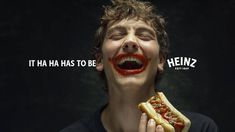 a young man with his mouth painted like a hot dog and the words, it ha ha has to be heinz?