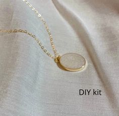 14k Gold Filled Cremation Necklace- DIY kit This DIY kit allows you to make cremation jewelry in the comfort of your own home🤍 Included in the kit: -step by step instructions -epoxy part A&B -pearl shimmer pigment -basic mixing tools -pendant and chain Pendant size: 16x12mm *ashes often vary in color, so stones may differ in shade! My Story: My name is Cam, jewelry has been my passion since I was a little girl, making bracelets for my mom to sell to her coworkers. In October of 2020 my family a Gifts For Grievers, Ash Jewelry Cremation, Ash Necklace Cremation Jewelry, Cremation Ashes Ideas, Gold Cremation Necklace, Gemstone Rings Diy, Cremation Jewelry Necklaces, Pet Ashes Jewelry, Memorial Jewelry Ashes