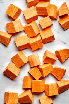 chopped up carrots sitting on top of a white counter