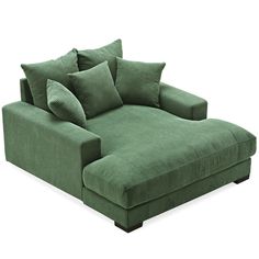 a green couch with pillows on it