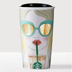 a starbucks cup with sunglasses on it and a drink in front of the cup is an image of a woman's face