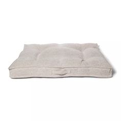 the dog bed is made from natural linen