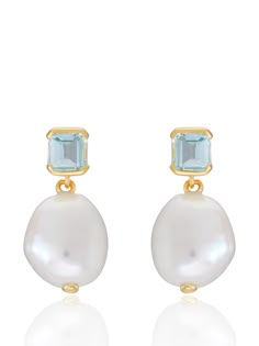 The Bella pearl earrings feature baroque pearl and step cut 'something blue' topaz, a staple in V jewellery and a nod to our Art Deco inspiration. The perfect bridal earrings that re-imagine classic vintage designs through a contemporary lens and can be worn effortlessly on your big day and beyond Made from 18 carat gold vermeil and set with a step cut blue topaz stone and baroque pearl. Please note as these earrings contain natural baroque pearls, the shape may differ slightly to those shown in the images provided. Height: Approx. 18mm. Width: Approx 8.5mm. Material: 18ct Gold Vermeil. Stone type and amount: Baroque Pearl & Blue Topaz. Something Blue Earrings, Blue Earrings Wedding, Art Deco Inspiration, Blue Topaz Stone, Gold And Blue, Step Cut, Topaz Stone, Earrings Wedding, Something Blue