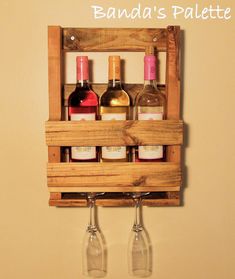 a wooden wine rack holding three bottles of wine