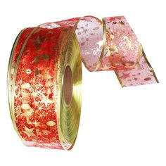 a roll of red and gold foiled christmas ribbon with stars on the side,