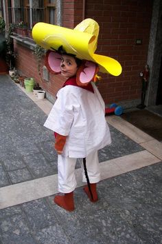 a child wearing a costume made to look like a banana splitper with a hat on it's head