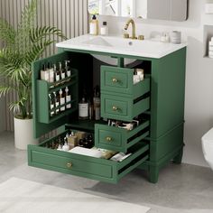 a bathroom with green drawers and white sink