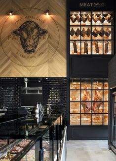 the interior of a meat shop with glass windows