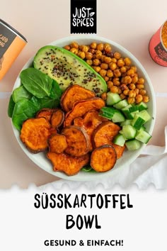 a bowl filled with different types of food on top of a white table next to a cup of coffee