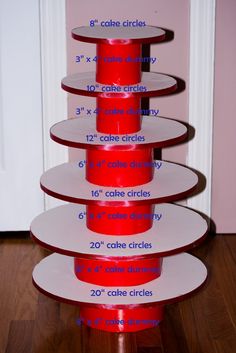 a stack of red cups sitting on top of a wooden floor