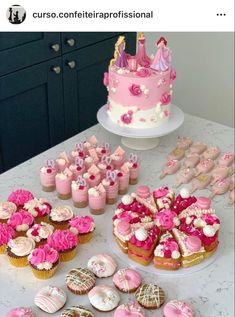 a table topped with lots of cupcakes and cakes