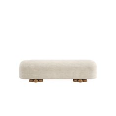 an upholstered bench with wooden legs and a white fabric cover on the back