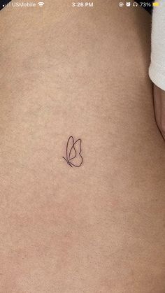 a person with a small tattoo on their back