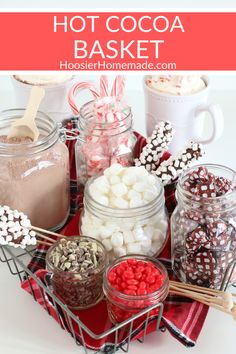 hot cocoa and marshmallows in glass jars with text overlay that says hot cocoa basket