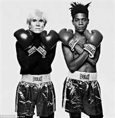 two people with boxing gloves on posing for a photo