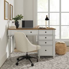 a white desk and chair in a room