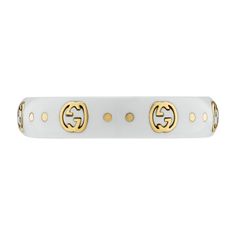 The Gucci Icon collection reprises one of the House's most emblematic motifs. The Interlocking G, representative of Founder Guccio Gucci's initials, is presented in 18k yellow gold, contrasting against a white synthetic corundum band. 18k yellow gold and white synthetic corundum Interlocking G engraving in gold .2" width This ring is a size 8 Made in Italy Gucci Style #: YBC679262002017 Luxury White Hallmarked Jewelry, Gucci White Round Jewelry, Classic White Gucci Jewelry, White Gucci Classic Jewelry, Gucci Classic Everyday Luxury Jewelry, Gucci Classic Jewelry For Everyday Luxury, Luxury Yellow Gold Jewelry, Luxury Monogram Rings, Luxury Gucci Round Ring