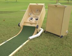 an inflatable slide is set up on the grass