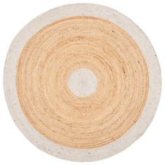 a round rug with white and tan colors on the bottom, in an oval shape