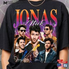 a man wearing a black shirt with the words jonas and his band members on it