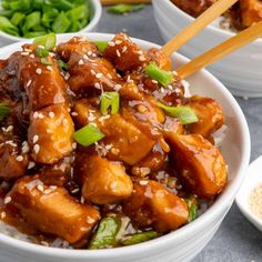 slow cooker general tso's chicken with chopsticks in a bowl